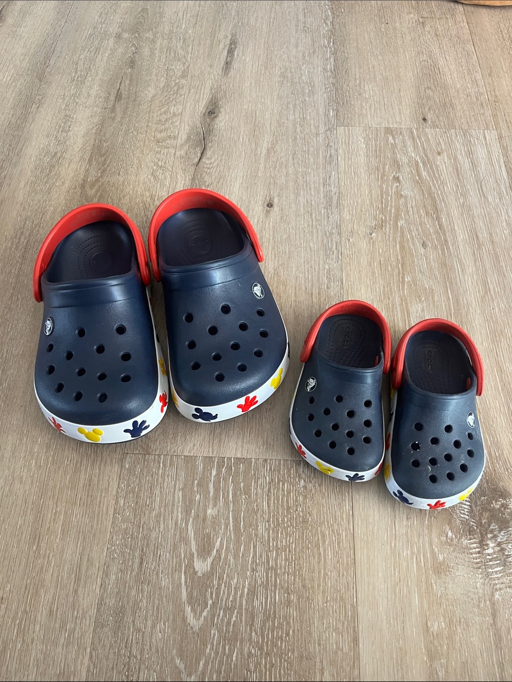 CROCS Kids Navy Clogs with Red Strap and Multicolor Floral Sole